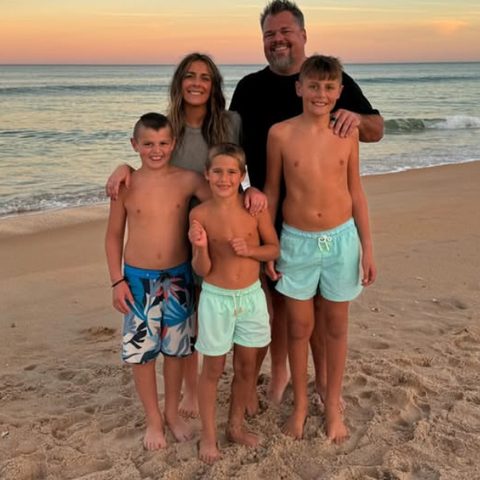Jeff & Amaya and family on the beach at sunset